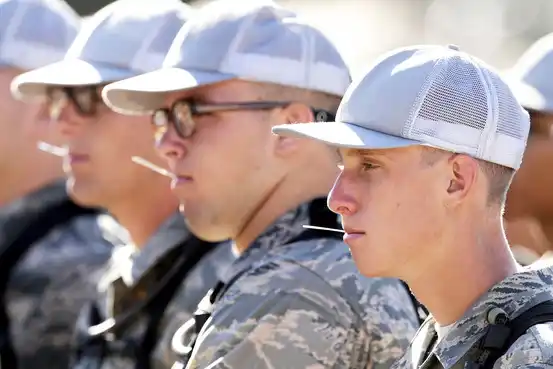 Basic cadet trainees get temperatures taken at the U.S. Air Force Academy in Colorado July 13. Several trainees this year tested positive for the H1N1 virus.